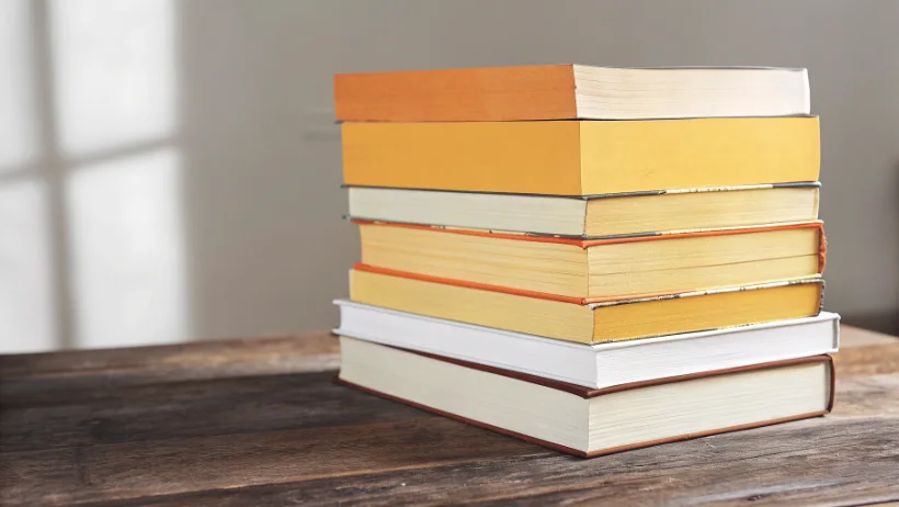 Stack of fiction books featuring gambling and strategic risk themes